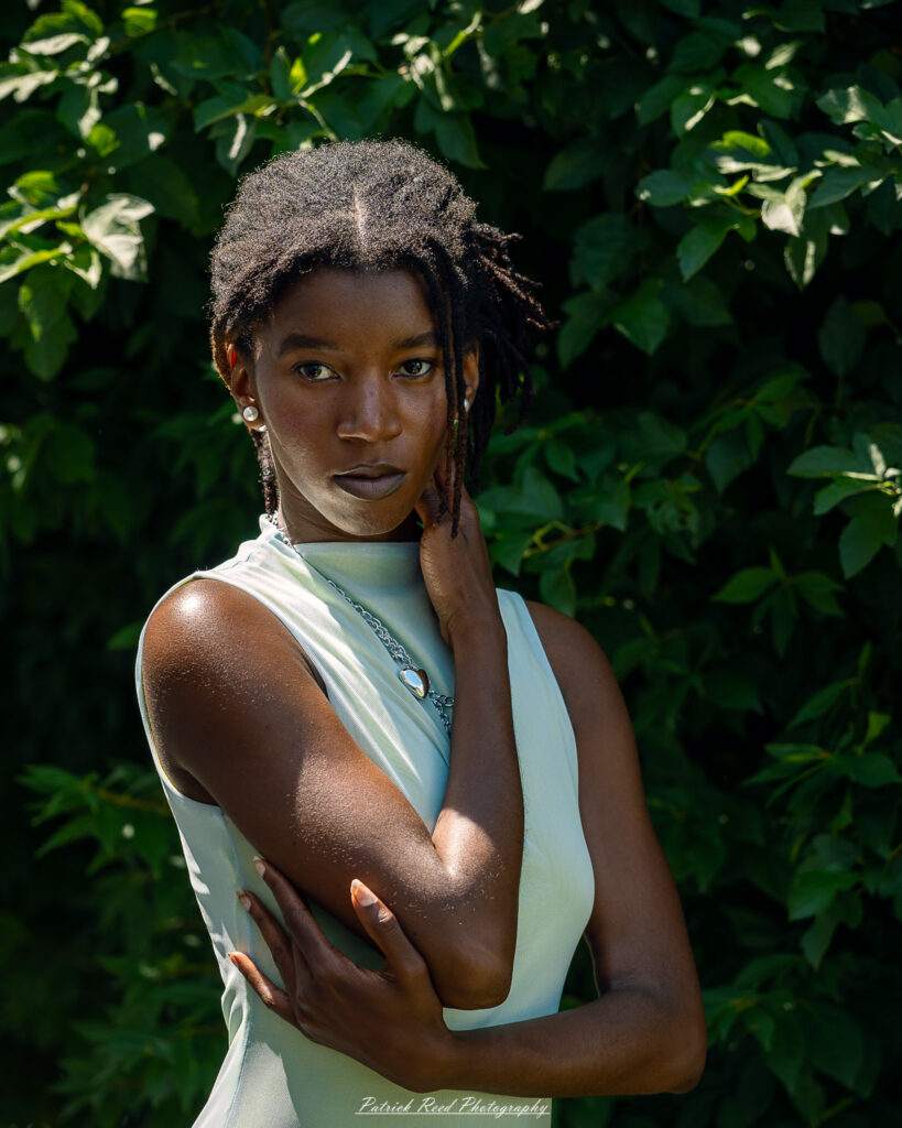 Natural light portrait of a model, photographed on June 28, 2025. She is posed outdoors with soft, flattering lighting, conveying a calm and confident expression.